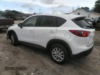 2014 Mazda CX-5 Touring z VIN JM3KE4CY0E0303748, wystawiony jako IAAI lot #42127406 z przebiegiem Nie podano mil oraz . Historia ofert i sprzedaży dostępna na DreamBid. Obrazek 3.