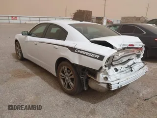 2014 Dodge Charger SXT with VIN 2C3CDXJG4EH232419, listed as a IAAI auction lot 41791324 with 127,910 mi miles. Bid and sale history available at carsss.com. Image 3.