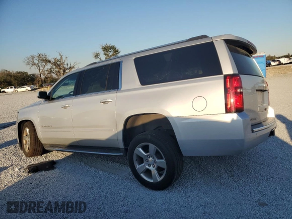 2020 Chevrolet Suburban Premier with VIN 1GNSCJKC9LR198484, listed as a Copart auction lot 87354514 with 115,008 mi miles and Salvage title. Bid and sale history available at DreamBid. Image 2.