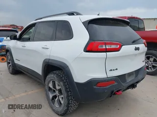 2015 Jeep Cherokee Trailhawk with VIN 1C4PJMBS9FW623740, listed as a IAAI auction lot 42131019 with 155,105 mi miles and . Bid and sale history available at DreamBid. Image 3.