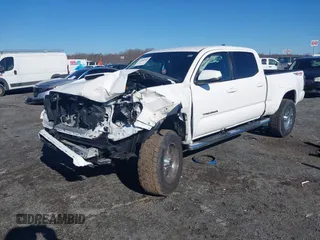 2021 Toyota Tacoma 4WD SR5 with VIN 3TYDZ5BN4MT000619, listed as a IAAI auction lot 41886686 with 91,338 mi miles. Bid and sale history available at carsss.com. Image 2.