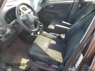 2010 Suzuki SX4 with VIN JS2YB5A24A6300249, listed as a Copart auction lot 71565394 with 291,886 mi miles and Salvage Title. Bid and sale history available at DreamBid. Image 7.
