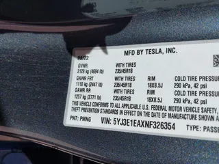 2022 Tesla Model 3 with VIN 5YJ3E1EAXNF326354, listed as a IAAI auction lot 41651872 with 27,922 mi miles and . Bid and sale history available at DreamBid. Image 9.