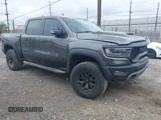 2022 Ram 1500 TRX z VIN 1C6SRFU98NN334983, wystawiony jako IAAI lot #42010145 z przebiegiem 19 207 mil mil oraz . Historia ofert i sprzedaży dostępna na DreamBid. Obrazek 1.