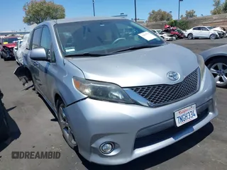 2014 Toyota Sienna SE with VIN 5TDXK3DC8ES417109, listed as a IAAI auction lot 42623735 with 96,234 mi miles and . Bid and sale history available at DreamBid. Image 1.
