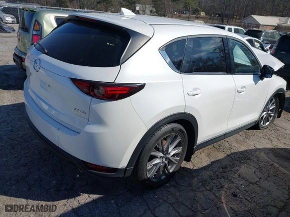 2020 Mazda CX-5 Grand Touring with VIN JM3KFADM3L1829208, listed as a IAAI auction lot 41684454 with 74,980 mi miles. Bid and sale history available at carsss.com. Image 4.