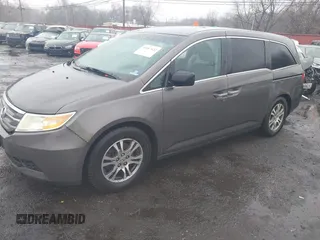 2012 Honda Odyssey EX-L with VIN 5FNRL5H64CB037689, listed as a IAAI auction lot 41857822 with 121,601 mi miles and . Bid and sale history available at carsss.com. Image 2.