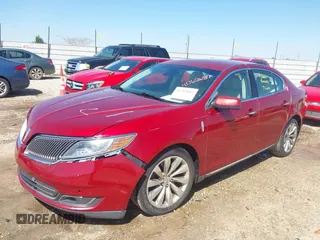 2013 Lincoln MKS with VIN 1LNHL9DK2DG612977, listed as a IAAI auction lot 41762687 with 149,420 mi miles. Bid and sale history available at carsss.com. Image 2.