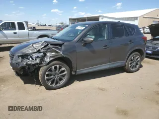 2016 Mazda CX-5 Grand Touring z VIN JM3KE4DY7G0637745, wystawiony jako Copart lot #56766005 z przebiegiem 98 652 mil mil oraz Szkoda całkowita • Salvage title. Historia ofert i sprzedaży dostępna na DreamBid. Obrazek 1.