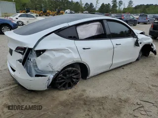 2021 Tesla Model Y Standard Range z VIN 5YJYGDED1MF109091, wystawiony jako Copart lot #50414004 z przebiegiem Nie podano mil oraz Szkody całkowita. Historia ofert i sprzedaży dostępna na DreamBid. Obrazek 3.