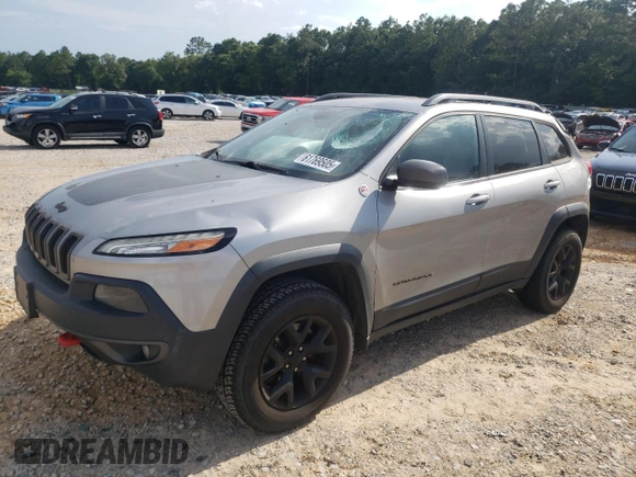 2016 Jeep Cherokee Trailhawk z VIN 1C4PJMBSXGW121272, wystawiony jako Copart lot #61769505 z przebiegiem 119 353 mil mil oraz Szkoda całkowita • Salvage title. Historia ofert i sprzedaży dostępna na DreamBid. Obrazek 1.