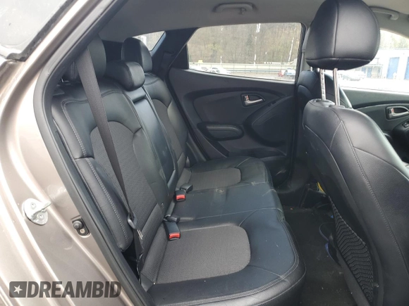 2011 Hyundai Tucson Limited with VIN KM8JUCAC2BU200517, listed as a Copart auction lot 53252005 with 158,502 mi miles and Salvage Title. Bid and sale history available at DreamBid. Image 11.