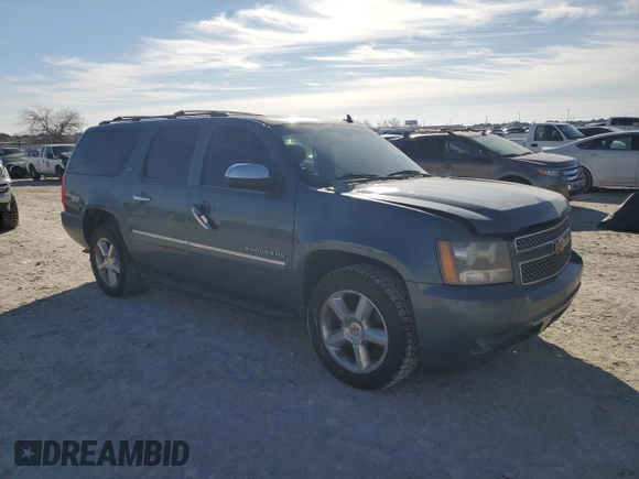 2010 Chevrolet Suburban LTZ with VIN 1GNUKKE37AR165641, listed as a Copart auction lot 88939935 with 203,190 mi miles and Salvage title. Bid and sale history available at DreamBid. Image 4.