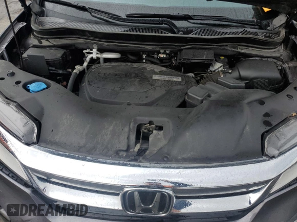 2020 Honda Pilot Touring 7-Passenger z VIN 5FNYF6H68LB052379, wystawiony jako Copart lot #57655775 z przebiegiem 73 501 mil mil oraz Szkoda całkowita • Salvage title. Historia ofert i sprzedaży dostępna na DreamBid. Obrazek 12.