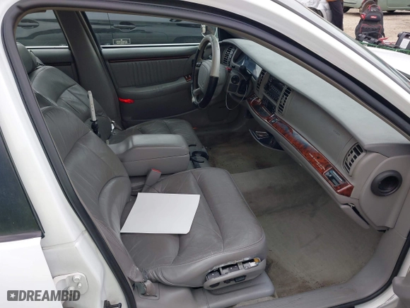 1999 Buick Park Avenue Ultra with VIN 1G4CU5217X4658627, listed as a IAAI auction lot 42013174 with 148,856 mi miles. Bid and sale history available at carsss.com. Image 5.