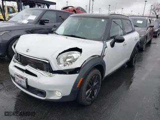 2016 MINI Cooper Countryman S with VIN WMWZC3C58GWT08920, listed as a IAAI auction lot 41576418 with 150,777 mi miles. Bid and sale history available at carsss.com. Image 2.