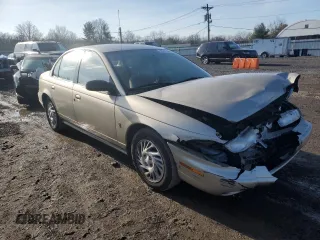 1999 Saturn SL z VIN 1G8ZK5270XZ212874, wystawiony jako Copart lot #85317464 z przebiegiem 153 477 mil mil oraz Szkoda całkowita • Salvage title. Historia ofert i sprzedaży dostępna na DreamBid. Obrazek 4.