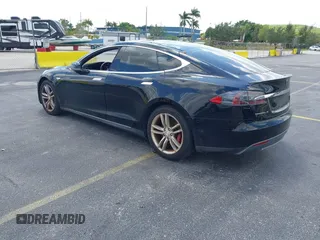 2015 Tesla Model S 85D with VIN 5YJSA1H21FFP79565, listed as a IAAI auction lot 42076401 with 162,139 mi miles. Bid and sale history available at carsss.com. Image 3.