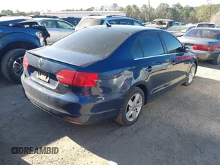2014 Volkswagen Jetta TDI w/Premium with VIN 3VWLL7AJ8EM432471, listed as a IAAI auction lot 41695764 with 116,083 mi miles and . Bid and sale history available at DreamBid. Image 4.