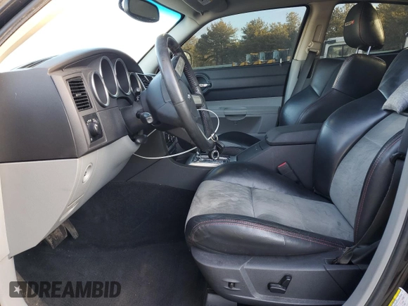 2006 Dodge Charger SRT-8 with VIN 2B3LA73W36H369475, listed as a Copart auction lot 43774705 with 130,495 mi miles and Salvage Title. Bid and sale history available at DreamBid. Image 7.
