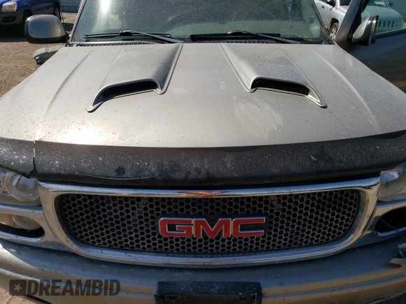 2003 GMC Sierra Denali z VIN 2GTFK69U831158334, wystawiony jako Copart lot #66320714 z przebiegiem Nie podano mil oraz Szkody całkowita. Historia ofert i sprzedaży dostępna na DreamBid. Obrazek 11.