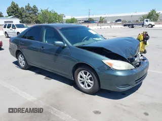 2004 Toyota Camry LE with VIN 4T1BF30K64U067898, listed as a IAAI auction lot 42131958 with 209,702 mi miles. Bid and sale history available at carsss.com. Image 1.