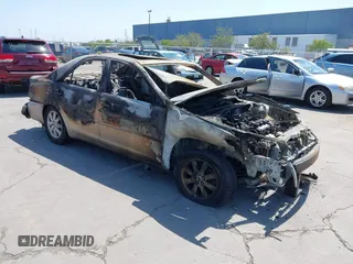 2003 Toyota Camry LE z VIN 4T1BF30K33U551509, wystawiony jako IAAI lot #42159776 z przebiegiem Nie podano mil oraz . Historia ofert i sprzedaży dostępna na DreamBid. Obrazek 1.