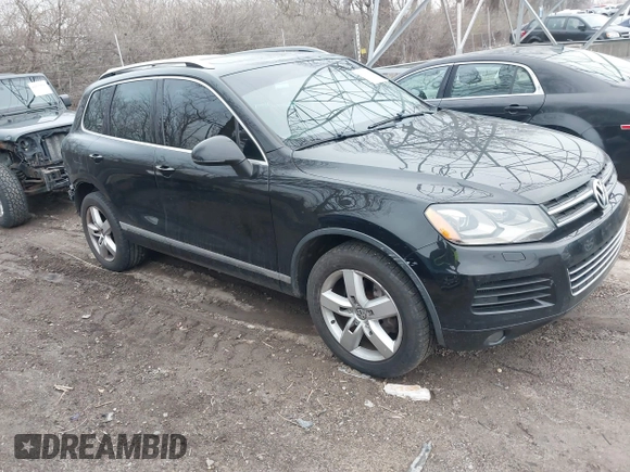 2012 Volkswagen Touareg Sport with VIN WVGFK9BP7CD002243, listed as a IAAI auction lot 41863765 with 136,231 mi miles and . Bid and sale history available at DreamBid. Image 1.
