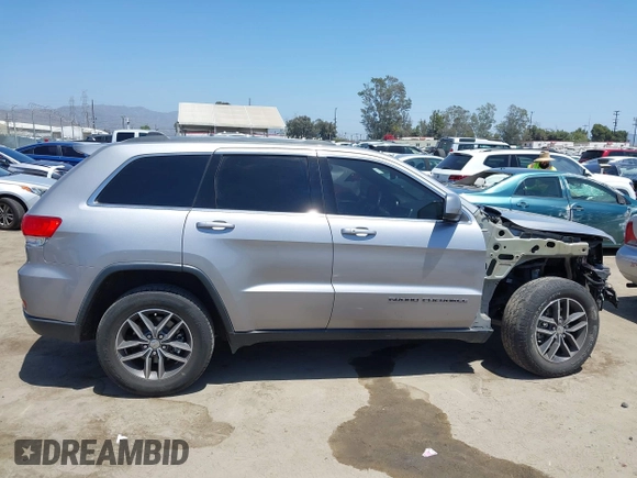 2018 Jeep Grand Cherokee Laredo E with VIN 1C4RJEAG2JC429850, listed as a IAAI auction lot 42541574 with 72,009 mi miles and . Bid and sale history available at DreamBid. Image 14.