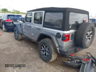 2021 Jeep Wrangler Unlimited Rubicon with VIN 1C4HJXFNXMW560512, listed as a IAAI auction lot 42124812 with 18,034 mi miles and . Bid and sale history available at DreamBid. Image 3.