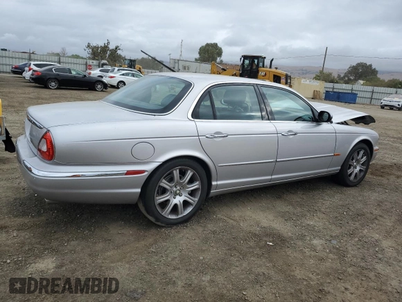 2004 Jaguar XJ with VIN SAJEA74C34SG09548, listed as a Copart auction lot 71754774 with 142,804 mi miles and Salvage Title. Bid and sale history available at DreamBid. Image 3.