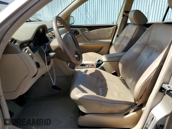 2000 Mercedes-Benz E-Class AWD with VIN WDBJH82J8YX042547, listed as a Copart auction lot 58063494 with 138,392 mi miles and Salvage Title. Bid and sale history available at carsss.com. Image 7.
