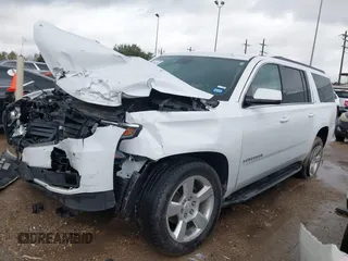 2020 Chevrolet Suburban LT z VIN 1GNSCHKC9LR284936, wystawiony jako IAAI lot #41196246 z przebiegiem Nie podano mil oraz . Historia ofert i sprzedaży dostępna na DreamBid. Obrazek 17.