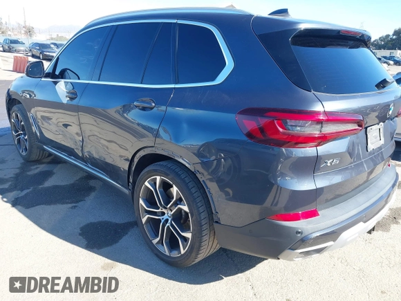 2021 BMW X5 sDrive40i with VIN 5UXCR4C08M9E15642, listed as a IAAI auction lot 41377524 with 76,050 mi miles. Bid and sale history available at carsss.com. Image 3.