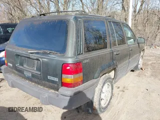 1993 Jeep Grand Cherokee Laredo with VIN 1J4GZ58S1PC680016, listed as a IAAI auction lot 41813392 with 149,520 mi miles. Bid and sale history available at carsss.com. Image 4.