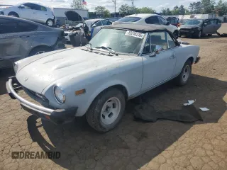 1978 FIAT 124 Spider z VIN 124CS10128701, wystawiony jako Copart lot #59208235 z przebiegiem 40 020 mil mil oraz Czysty tytuł • Clean title. Historia ofert i sprzedaży dostępna na DreamBid. Obrazek 1.
