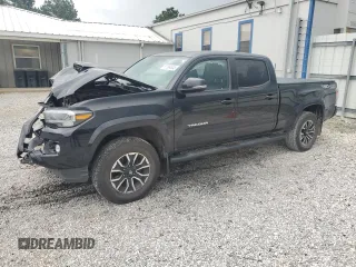 2021 Toyota Tacoma SR5 with VIN 3TYDZ5BNXMT000852, listed as a Copart auction lot 57564545 with 104,647 mi miles and Salvage title. Bid and sale history available at DreamBid. Image 1.