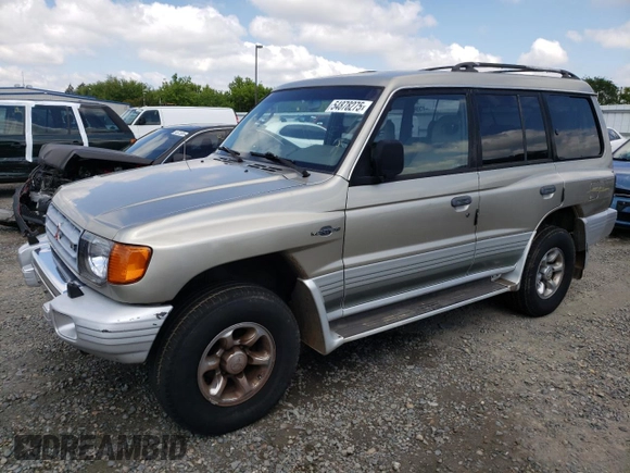 1998 Mitsubishi Montero z VIN JA4MR51RXWJ006418, wystawiony jako Copart lot #54878275 z przebiegiem 225 110 mil mil oraz Szkoda całkowita • Salvage title. Historia ofert i sprzedaży dostępna na DreamBid. Obrazek 1.