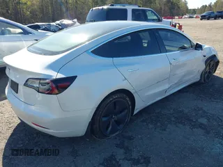 2020 Tesla Model 3 Standard Range Plus with VIN 5YJ3E1EA7LF797150, listed as a IAAI auction lot 41869088 with 75,708 mi miles and . Bid and sale history available at carsss.com. Image 4.