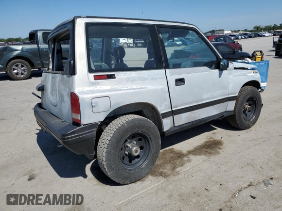 1991 Geo Tracker z VIN 2CNBJ18U3M6909006, wystawiony jako Copart lot #73638944 z przebiegiem 65 033 mil mil oraz Tytuł czysty. Historia ofert i sprzedaży dostępna na DreamBid. Obrazek 3.