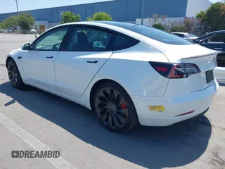 2022 Tesla Model 3 Performance with VIN 5YJ3E1ECXNF270238, listed as a IAAI auction lot 42173668 with 13,017 mi miles and . Bid and sale history available at DreamBid. Image 3.