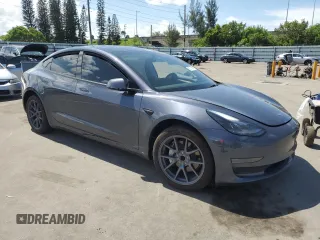 2023 Tesla Model 3 with VIN 5YJ3E1EA8PF704349, listed as a Copart auction lot 60220665 with 18,873 mi miles and Non repairable. Bid and sale history available at DreamBid. Image 4.