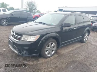 2014 Dodge Journey Limited with VIN 3C4PDDDG4ET141164, listed as a IAAI auction lot 42255057 with 195,135 mi miles and . Bid and sale history available at DreamBid. Image 2.