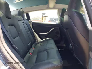 2023 Tesla Model 3 with VIN 5YJ3E1EA1PF545402, listed as a IAAI auction lot 42671354 with 37,948 mi miles and . Bid and sale history available at DreamBid. Image 8.