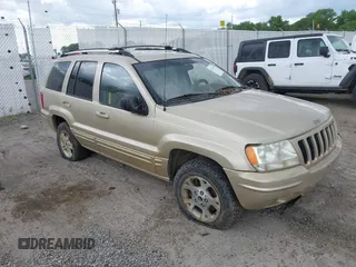 1999 Jeep Grand Cherokee Limited with VIN 1J4GW68SXXC664055, listed as a IAAI auction lot 42339125 with 219,792 mi miles and . Bid and sale history available at DreamBid. Image 1.