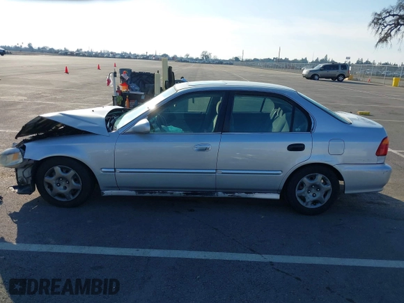 1999 Honda Civic EX with VIN JHMEJ8648XS000823, listed as a IAAI auction lot 41479594 with 299,294 mi miles. Bid and sale history available at carsss.com. Image 15.