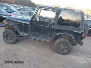 1990 Jeep Wrangler with VIN 2J4FY29T2LJ543655, listed as a IAAI auction lot 41766772 with 999,999 mi miles. Bid and sale history available at carsss.com. Image 3.