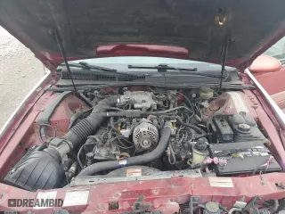 1996 Ford Thunderbird LX with VIN 1FALP62W7TH135632, listed as a Copart auction lot 77134024 with 128,931 mi miles and Salvage Title. Bid and sale history available at carsss.com. Image 12.