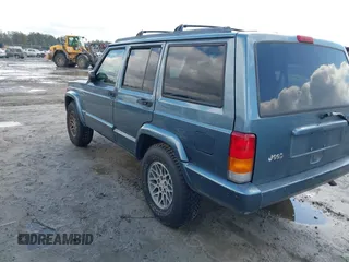 1998 Jeep Cherokee Sport with VIN 1J4FT68S0WL125382, listed as a IAAI auction lot 41551866 with 1 mi miles. Bid and sale history available at carsss.com. Image 3.
