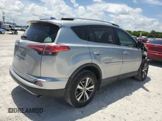2018 Toyota RAV4 XLE with VIN 2T3WFREV7JW423768, listed as a Copart auction lot 61841875 with 111,991 mi miles and Salvage title. Bid and sale history available at DreamBid. Image 3.